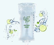 An intravenous fluid bag labeled "Detox Drip" is surrounded by splashes of water, ice cubes, and cucumber slices on a light blue background.